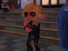 a cartoon squid wearing sunglasses and a leather jacket is standing on a staircase .
