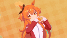 a girl with orange hair making a heart shape with her hands