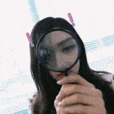 a woman is looking through a magnifying glass with an exclamation point on her head