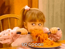 a little girl is eating spaghetti with a fork and knife while saying so good !