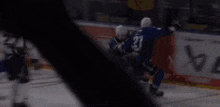 a hockey player with the number 31 on his jersey stands in front of a goal