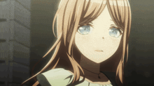 a girl with brown hair and blue eyes looks sad