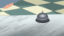 a cartoon drawing of a bell on a checkerboard floor