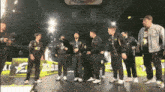 a group of men are standing on a stage with a sign that says ' lg ' on it