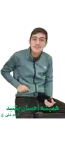a man wearing a green adidas jacket holds a cell phone