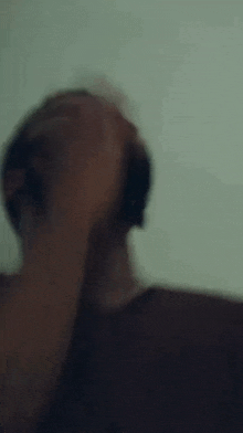a blurry picture of a person 's hand reaching up towards the camera .