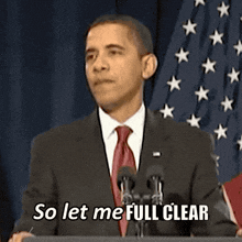 a man in a suit and tie is giving a speech and says so let me full clear