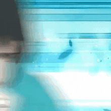 a blurry picture of a person 's face and a blue background