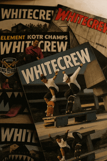 a stack of white crew magazines on a white surface