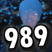 a picture of a man with glasses and the number 989 in front of him