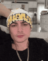 a young man wearing a headband that says swag