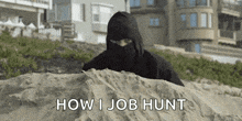 a man in a ninja costume is hiding in the sand .