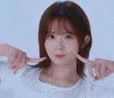 a woman making a funny face with her hands on her face
