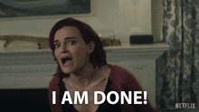 a woman with red hair is screaming and says i am done