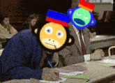 a man wearing a monkey mask sits at a desk with other people