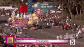 a city of hope parade with a sign that says happy new year on it