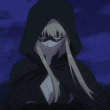a woman in a black hooded cape holds a glowing object in her hand