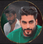 a man with a beard and a green shirt is in a circle