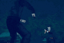 a man in a black jacket is standing next to another man in a black jacket