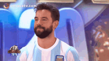 a man with a beard is wearing a shirt that says argentina on it