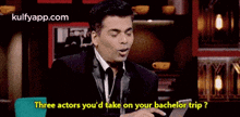 a man in a suit and tie is sitting in front of a laptop and talking about three actors he 'd take on his bachelor trip