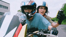 a man wearing a helmet that says arai is riding a motorcycle