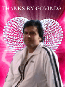 a man in a white adidas jacket is standing in front of a pink background