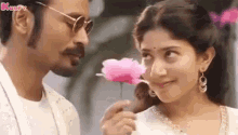 Flower Giving Dhanush GIF - Flower Giving Dhanush Sai Pallavi GIFs