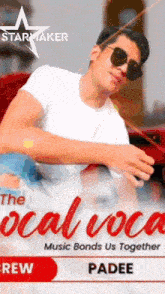 a man wearing sunglasses and a white shirt is sitting in a red car on a poster for starmaker