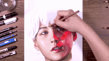 a person is drawing a woman 's face with a marker that says ' zebra ' on it