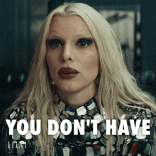 a woman with long blonde hair has the words " you don 't have " on her face