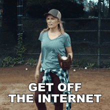 a woman in a baseball cap and glove says " get off the internet "