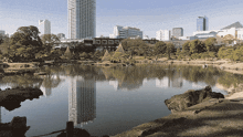 a large body of water surrounded by trees and buildings with the word orro on the bottom