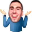 a man in a blue sweater is smiling with his hands up .