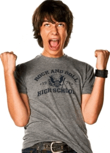 a young man wearing a rock and roll high school t-shirt