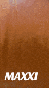 the word maxxi that is on a brown surface