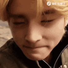 a close up of a person making a funny face .