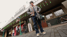 a man standing in front of a building with chinese writing