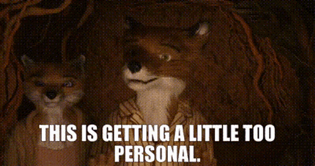 a couple of foxes are standing next to each other and they are getting a little too personal .