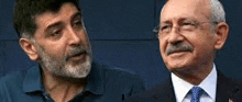 two men with beard and mustache are standing next to each other .