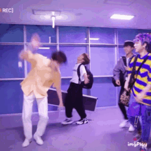 a group of people are dancing in a room with the words rec on the top