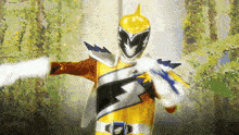 a yellow power ranger with a shark on his chest