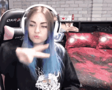 a girl wearing headphones and a shirt that says i love ny on it