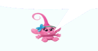 a pink troll with a blue bow on her head is sitting on a white surface