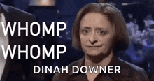 a woman is making a funny face with the words `` whomp whomp dinah downer '' written above her .