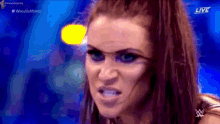 a close up of a woman 's face with the word live on the bottom right