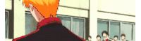 a man with orange hair is standing in front of a crowd of people .