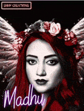 a woman with red hair and a flower crown on her head is named madhu
