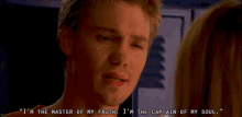 a man says " i 'm the master of my faith " while looking at a woman