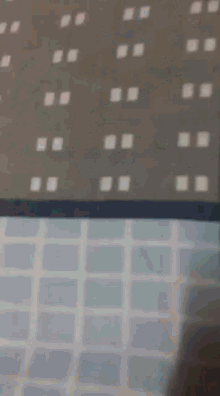 a person laying on a bed with their feet on a blanket